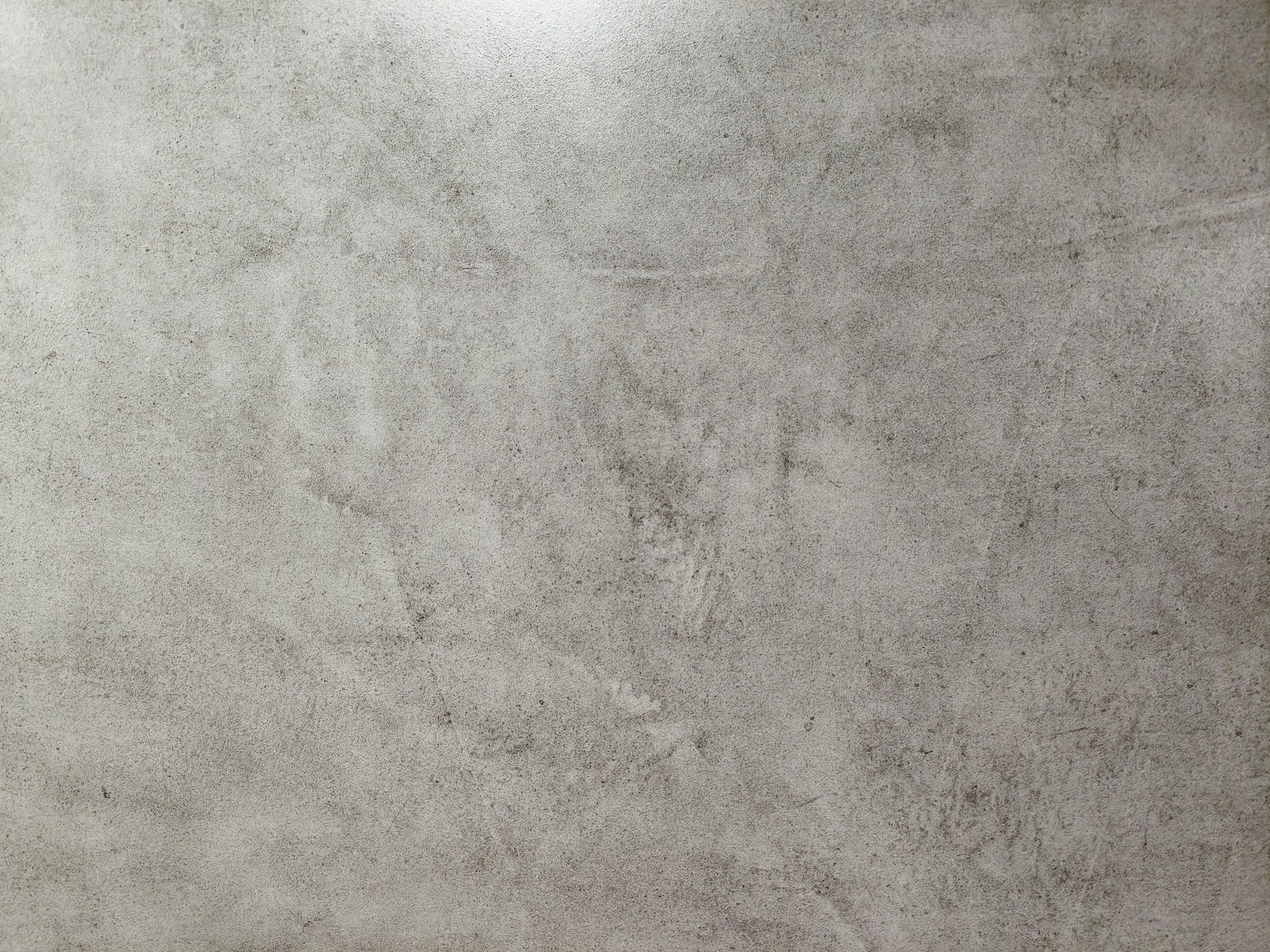 Weathered concrete surface showing formwork marks and decades of patina